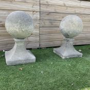 Pair of cast stone garden spherical ball finials or gatepost tops