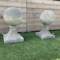Pair of cast stone garden spherical ball finials or gatepost tops