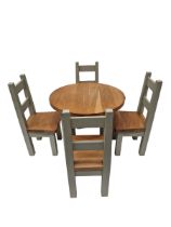 Solid oak round panted dining table and four chairs