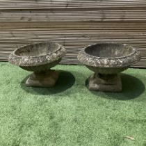 Cast stone garden planters on plinths