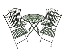 Wrought metal slatted round folding garden table and four chairs in green finish