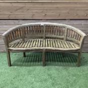 Teak serpentine curved garden bench