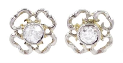 Pair of gold and platinum old cut diamond flower head stud earrings