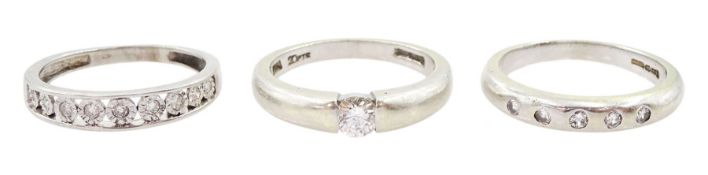 Three 9ct white gold round brilliant cut diamond rings including five stone rubover set