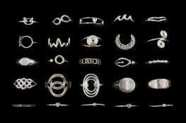 Twenty-five silver rings including crescent