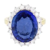 18ct gold oval cut unheated sapphire and round brilliant cut diamond ring