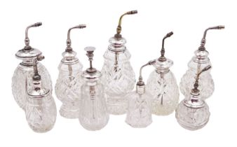 Nine early 20th century silver mounted cut glass atomiser bottles