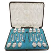 Set of twelve Edwardian silver teaspoons and a pair of matching sugar tongs