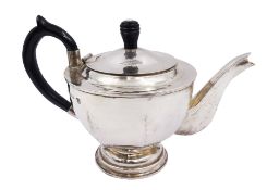 Modern Arts and Crafts style silver teapot