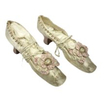 Pair of 19th century ivory silk satin ladies shoes