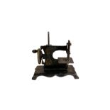 Miniature tinplate sewing machine