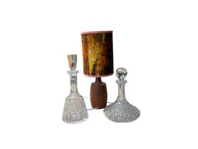 Wooden table lamp with shade together with two glass decanters