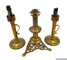 Brass candlestick with a knopt stems and triform base