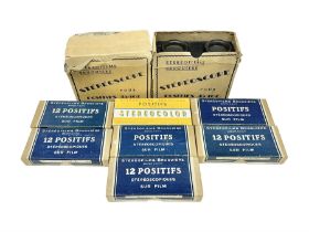 Two Stereofilms Bruguiere stereoscopes with seven boxes of related stereo positive slides to include