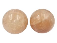 Pair of orange calcite spheres