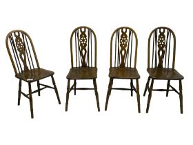 Set of four elm and beech Windsor design dining chairs