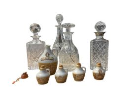 Four glass decanters