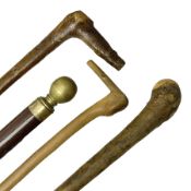 Four wooden walking canes