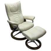 Stressless by Ekornes - 'Signature Wing' reclining armchair with matching footstool
