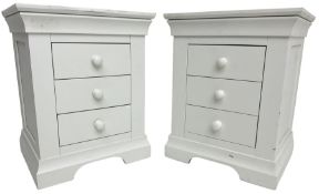Pair of contemporary white painted pedestal bedside chests