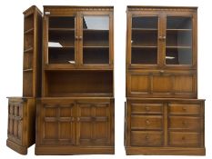 Ercol - mid-20th century dark elm 'Old Colonial' three sectional wall display unit