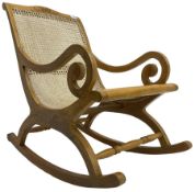Late 20th century teak framed plantation style rocking chair