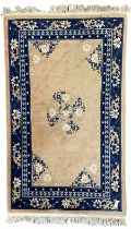 Chinese washed woollen peach ground rug