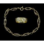 Gold fancy openwork twist link bracelet and a gold wedding band