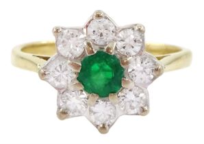 Gold emerald and round brilliant cut diamond cluster ring