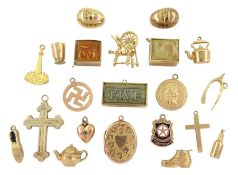 Twenty 9ct gold pendant / charms including cross