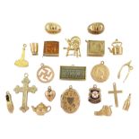 Twenty 9ct gold pendant / charms including cross