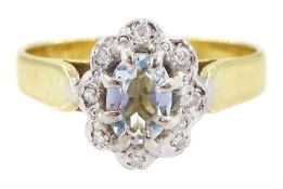 18ct gold oval cut aquamarine and round brilliant cut diamond cluster ring