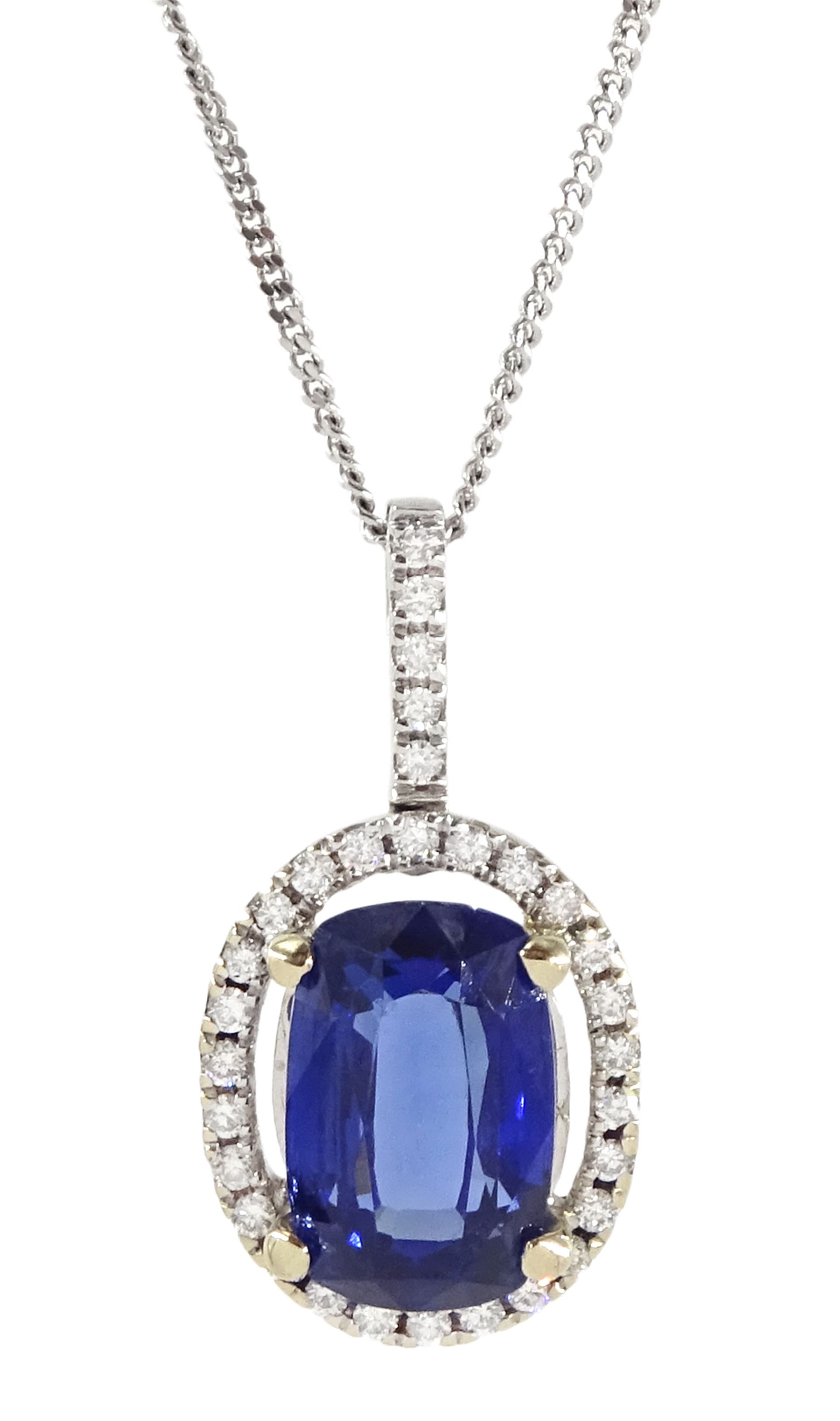 18ct white gold rectangular cushion cut sapphire and round brilliant cut diamond halo cluster pendan