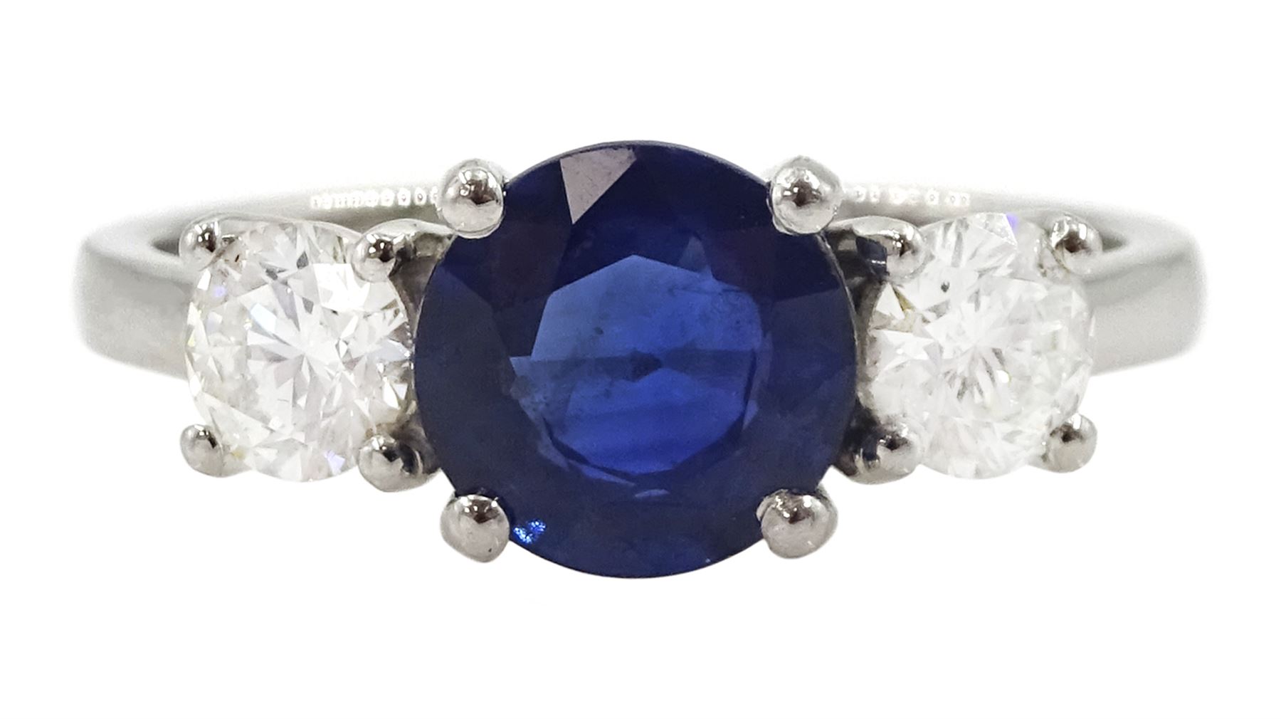 Platinum three stone sapphire and round brilliant cut diamond ring