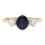 Gold three stone oval cut sapphire and round brilliant cut diamond ring