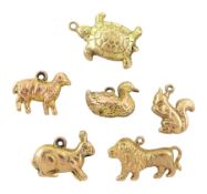 Six 9ct gold pendant / charms including duck
