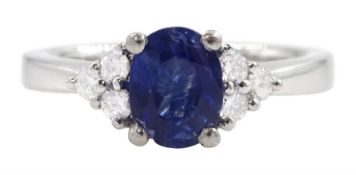 Platinum oval cut sapphire and six stone round brilliant cut diamond ring