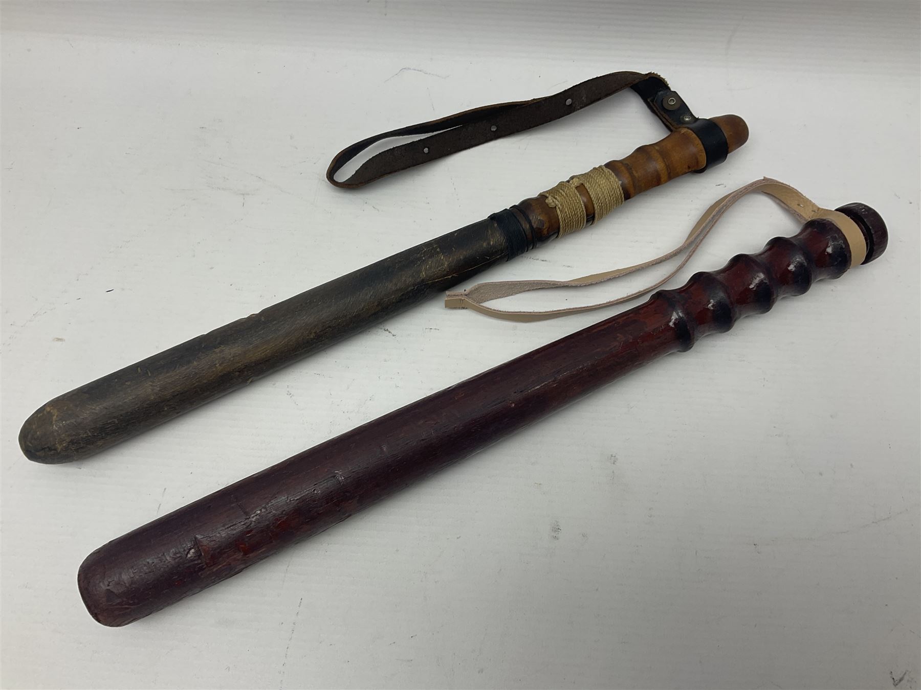 Two wooden truncheon with turned grips and leather straps - Image 11 of 14