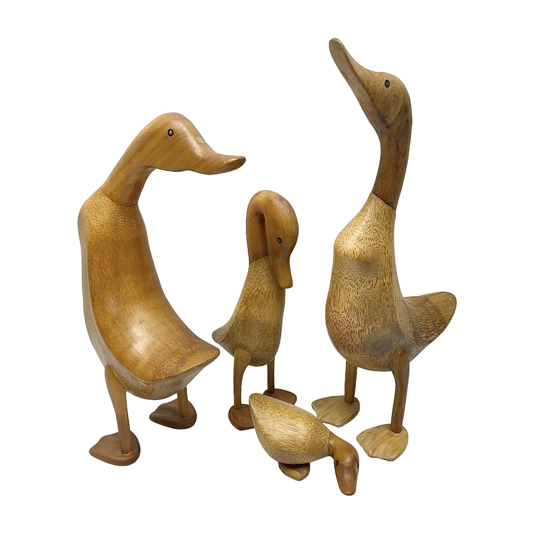 Four carved fruit wood ducks by Dcuk of various sizes