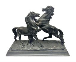 Bronzed figure group of two rearing horses