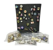 Large collection of approximately one hundred enamel badges and key rings