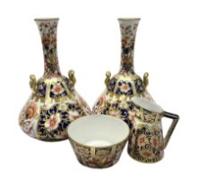 Pair of Royal Crown Derby 6299 imari pattern miniature vases