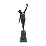 Bronzed semi nude female figure with one hand raised