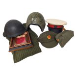 Royal Marine dress cap and two other military helmets