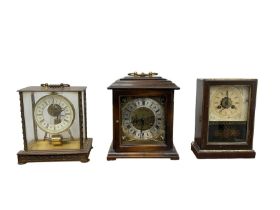 19th century American shelf clock with an alarm and two 20th century mantle clocks.