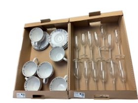 Six coffee cups and saucers together with a group of champagne flutes