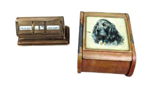 1920s brass perpetual calendar and a small metal trinket box with spaniel decoration