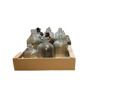 Eleven glass demijohns