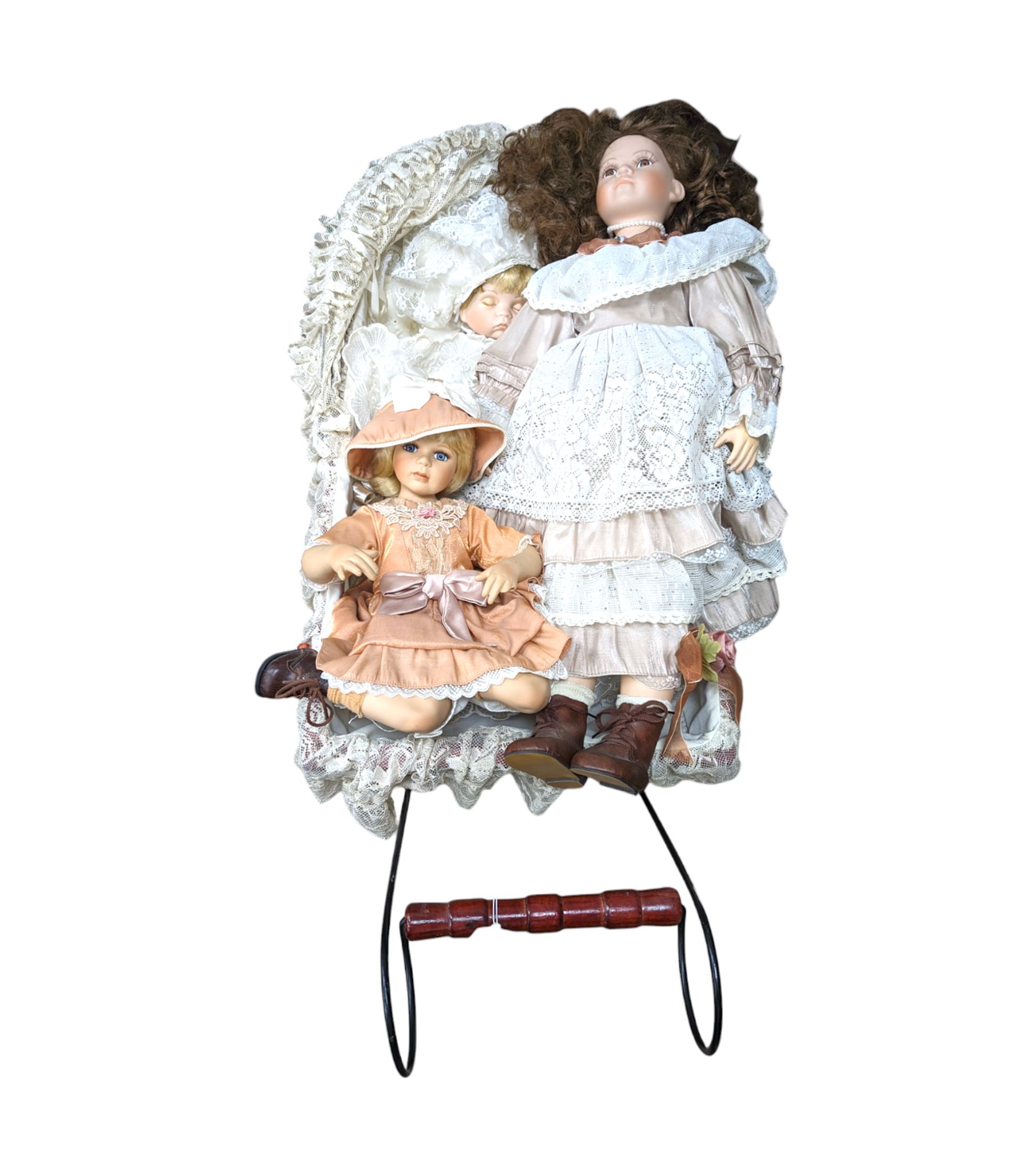 Three porcelain dolls and a wicker dolls pram with lace cover - Image 2 of 2