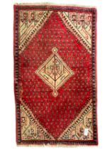 Small Persian red ground rug